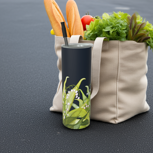 Lily of the Valley tumbler in matte finish showcasing May’s birth flower, beside a canvas tote bag.