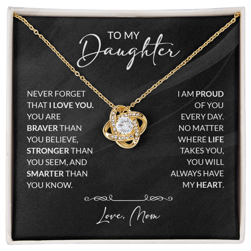 ShineOn Fulfillment jewelry with engraved message "To My Daughter — Braver Than You Believe" on a silver pendant.